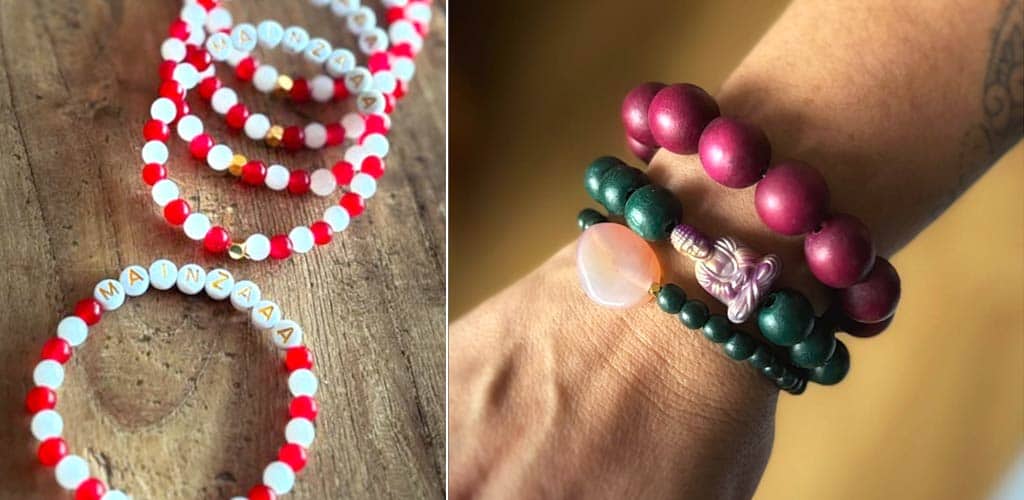 Handgefertigter Schmuck von Sabine Stühmeier: Verschiedene bunte Armbänder aus Perlen und Edelsteinen, liebevoll gestaltet, auf Holzoberflächen und am Handgelenk getragen.